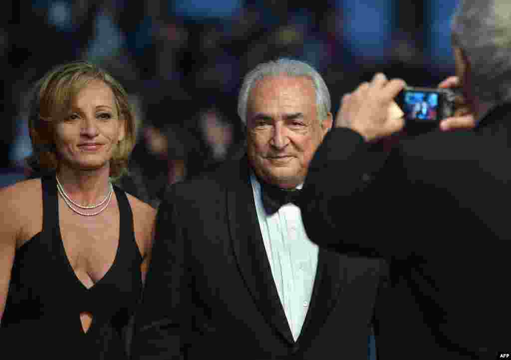 Former IMF chief Dominique Strauss-Kahn and marketing executive Myriam L'Aouffir arrive in Cannes to attend the screening of the film "Only Lovers Left Alive." (AFP/Alberto Pizzoli)