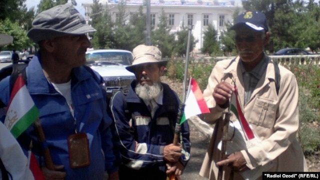 Three of the Kulob pilgrims as they set out on their 4,600-kilometer journey to Mecca in early June.