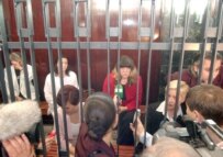 Foreign media attempt to interview the five Bulgarian nurses after their retrial adjourned today in Tripoli (epa)
