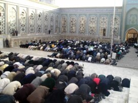 Tajik Muslims pray in the central mosque of Dushanbe