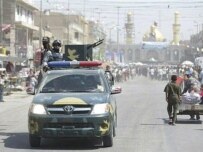 Iraqi special forces patrol Karbala, where thousands of Shi'a are on a pilgrimage (AFP)