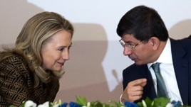 Turkish Foreign Minister Ahmet Davutoglu speaks with U.S. Secretary of State Hillary Clinton in Istanbul earlier this month.