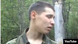 Kazakh border guard Vladislav Chelakh, seen here in a publicly available video, has been charged with the killing spree.