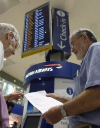 A passenger studies security information at Heathrow today (epa)
