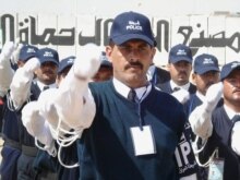 Iraq -- Iraqi police cadets during a graduation ceremony at the police academy in Al-Najaf, 22Mar2007