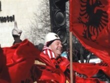 Kosovo -- A Kosovo Albanian waves a flag in Pristina, 17Feb2008