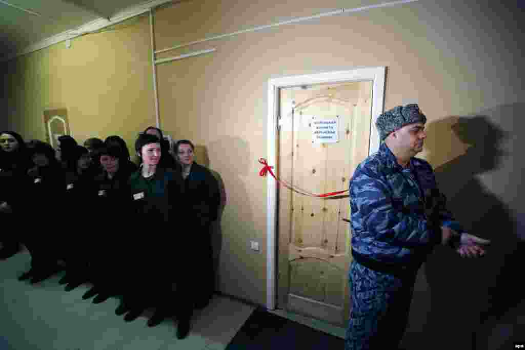 Jewish prisoners and prison officials attend the opening ceremony of a female Jewish prayer room at correctional colony N2 in Ulyanovka, about 40 kilometers from St. Petersburg, Russia. It will be the first prayer room opened for convicted Jewish women in Russia. (epa/Anatoly Maltsev)