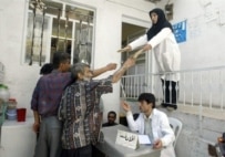 Activists from an Iranian NGO hand out syringes to Tehran drug addicts in a bid to prevent disease transmission (AFP)