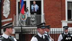 WikiLeaks founder Julian Assange addresses reporters and supporters from a balcony of Ecuador's embassy in London on August 19.