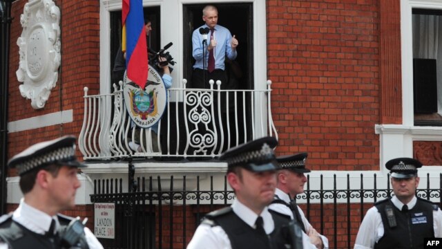 WikiLeaks founder Julian Assange addresses reporters and supporters from a balcony of Ecuador's embassy in London on August 19.