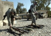 U.S. forces showing weapons confiscated from insurgents in Iraq last month (epa)