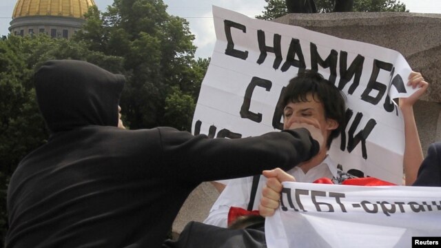 A man attacks an activist during a gay-pride parade in St. Petersburg last year, typical of the violence marchers face.