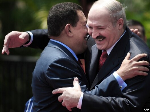 President Hugo Chavez and his Belarusian counterpart Alyaksandr Lukashenka embrace each other at the Miraflores presidential palace in Caracas.