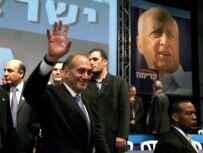 Kadima party leader Ehud Olmert claiming victory on March 29 (epa)