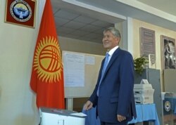 Kyrgyz President Almazbek Atambaev casts his ballot at a polling station in Bishkek.