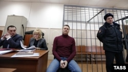 Russian opposition leader Aleksei Navalny (center) attends a court hearing in Moscow on February 28.