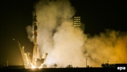 A Soyuz TMA-13M spacecraft carrying the ISS crew of Alexander Gerst (Germany), Maksim Suraev (Russia) and Reid Wiseman (U.S.A.) blasts off from the launch pad at the Baikonur cosmodrome in Kazakhstan on May 29.