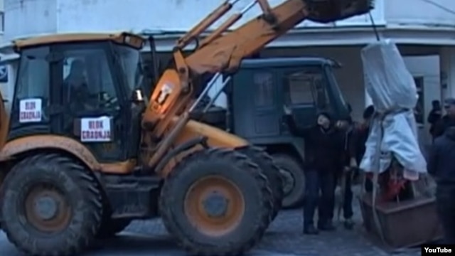 The marble monument was removed from a central square in Presevo.