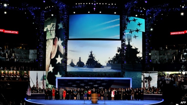 Retired U.S. Navy Admiral John B. Nathman speaks in front of a giant backdrop of what turns out are Russian Navy warships at the Democratic National Convention on September 6.