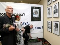 Participants at the Moscow congress looking at photographs of the dozens of journalists slain in Russia in recent years (epa)