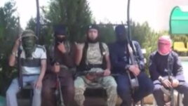 Скриншот видеоролика таджикских боевиков, воюющих в Сирии на стороне ИГ.