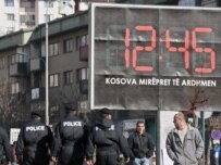 A billboard in Pristina reads, \