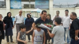 Iranian pastor Youcef Nadarkhani meets his family upon being released from prison on September 8. 