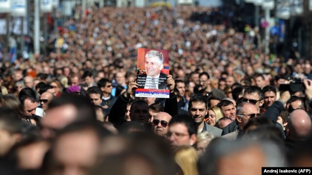 More than 15,000 people marched in Belgrade on March 12 in silence to mark the 10th anniversary of the assassination of Serbian Prime Minister Zoran Djindjic.
