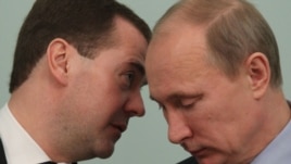 Prime Minister Vladimir Putin (left) and President Dmitry Medvedev