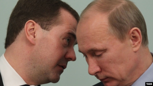 Prime Minister Vladimir Putin (left) and President Dmitry Medvedev