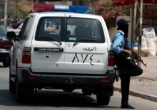 Iraq -- policeman (stands guard) 6/15/05