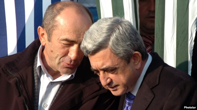 Armenia - President Serzh Sarkisian (R) and his predecessor Robert Kocharian at an official ceremony outside Yerevan, 1Dec2008.