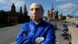 Russian activist Roman Roslovtsev, wearing a rubber mask depicting President Vladimir Putin, poses for a picture in central Moscow on May 12.