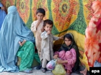 A woman and her family arrive in Peshawar after fleeing the restive Bajaur tribal area.