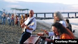 Ken Hensley plays ''July Morning" with Bulgarian musicians on the Black Sea coast on July 1, 2009.