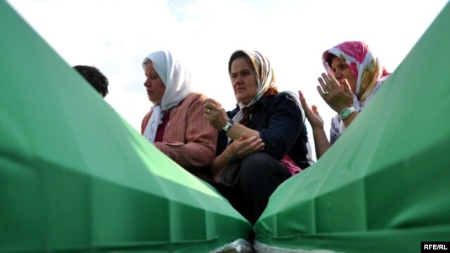 Coffins of newly identified victims during preparations for their mass burial at the Potocari memorial cemetery near Srebrenica  