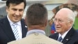 Georgia -- President Mikheil Saakashvili (L) and US Vice President Dick Cheney speak to a USAID employee in Tbilisi, 04Sep2008 