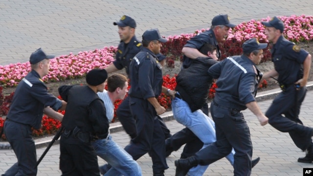 Belarusian policemen detain protesters during a demonstration in Minsk last month.