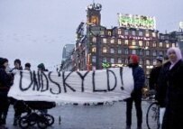 Young Danes hold a banner reading 'Sorry' to the Muslim world on 1 February. (epa)