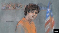 An artist's drawing of Dzhokhar Tsarnaev during his arraignment on 30 federal charges stemming from the events surrounding the Boston Marathon bombing, in the Joseph Moakley Federal Court House in Boston on July 10, 2013.