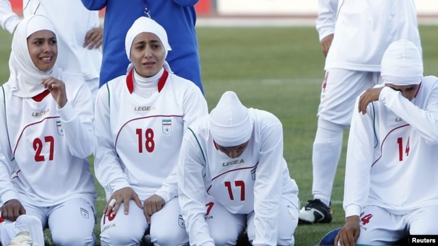 Players for Iran's women's national soccer team react after the disqualification announcement in Amman, Jordan, on June 3.