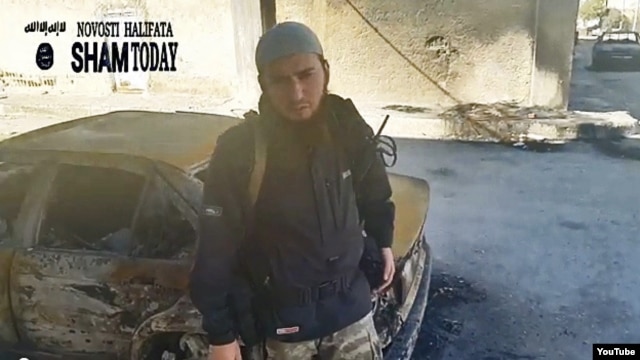 A screen grab from a  video purportedly showing a Chechen militant in Syria exhorting his compatriots to join Islamic State. 