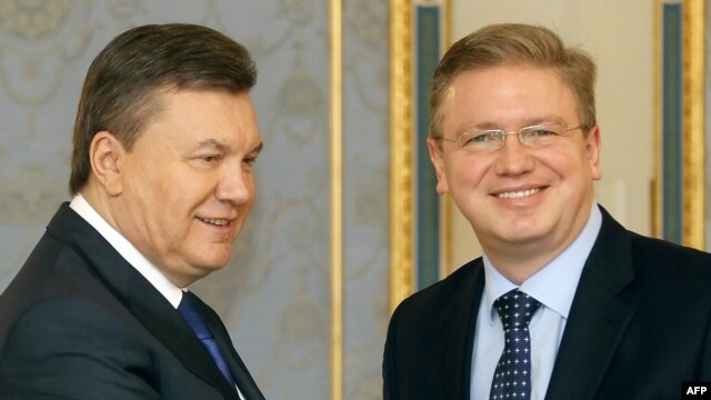 Ukrainian President Viktor Yanukovych (left) and European Enlargement Commissioner Stefan Fuele in Kyiv on February 8.