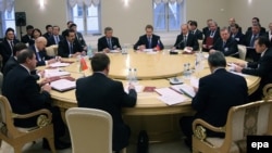 Then-Russian Prime Minister Vladimir Putin (third from right) chairs a Eurasian Customs Union meeting in 2009.