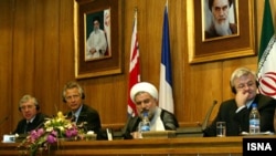 Iranian President Hassan Rohani has previously served as Iran’s top nuclear negotiator (second from right), here with British Foreign Secretary Jack Straw (left), French Foreign Minister Dominique de Villepin (second left), and German Foreign Minister Joschka Fischer (right) during nuclear talks in 2003.