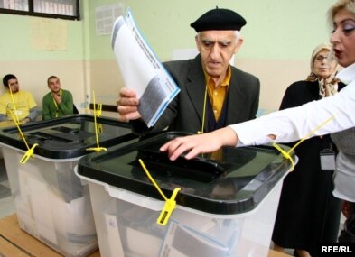 A man casts his vote at a polling station in Kosovo's capital, Pristina, on November 15.