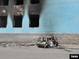 A burned-out house following ethnic clashes in Osh