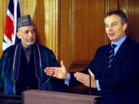 Across town, President Karzai (left) was meeting with Prime Minister Blair on February 14 (epa)