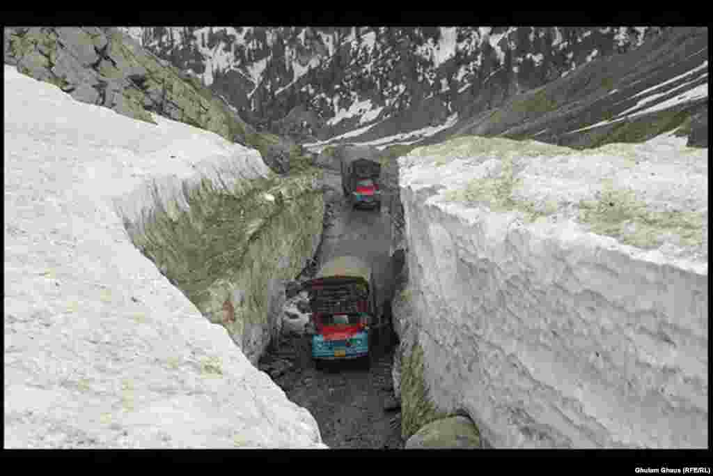 Trucks navigate a mountain road as snow and rain wreak havoc in Pakistan's northern Kyber Pakhtunkhwa and FATA regions.