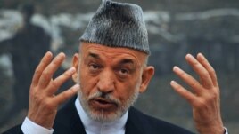 Afghan President Hamid Karzai speaks during a press conference at the Presidential Palace in Kabul on June 12.